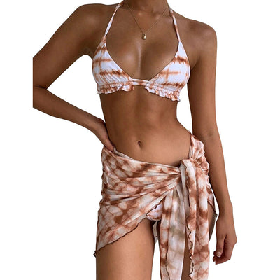Blue leopard print bikini with matching sarong skirt, featuring gold tassels and chain details, modeled by a woman by a pool. - Image 13