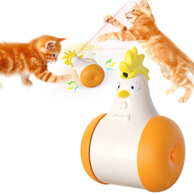 White and yellow chicken-shaped tumbler cat toy with a laser pointer, being played with by two orange tabby cats. - Image 4