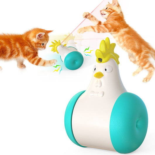 White and yellow chicken-shaped tumbler cat toy with a laser pointer, being played with by two orange tabby cats. - Image 5