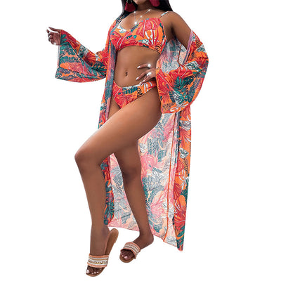 Women's three-piece tropical print bikini and kimono cover-up set in orange, green, and pink. - Image 2