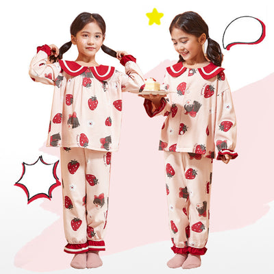 Young girl wearing a light pink two-piece pajama set with red Peter Pan collar and strawberry print. - Image 10