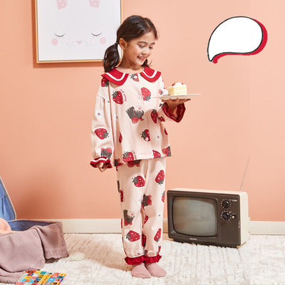 Young girl wearing a light pink two-piece pajama set with red Peter Pan collar and strawberry print. - Image 9