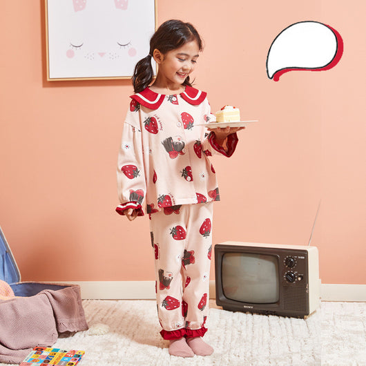 Young girl wearing a light pink two-piece pajama set with red Peter Pan collar and strawberry print. - Image 9