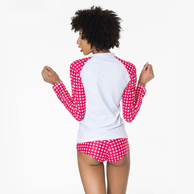 Woman wearing a red and white gingham long-sleeve rash guard top with matching bikini bottoms. - Image 5