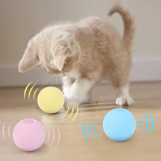 Light yellow interactive cat toy ball with a cricket sound feature, shown next to its yellow packaging. - Image 11