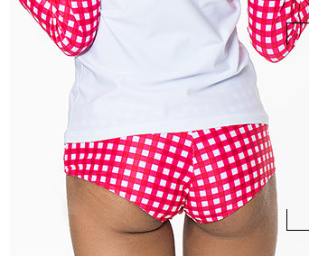 Woman wearing a red and white gingham long-sleeve rash guard top with matching bikini bottoms. - Image 12