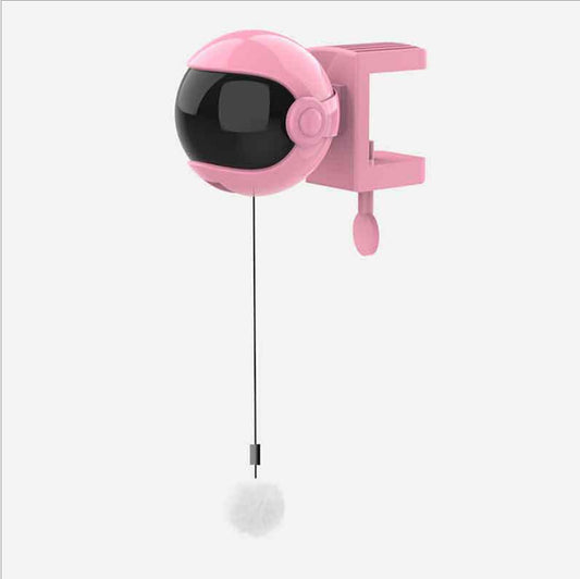 White automatic cat toy with a spherical unit resembling an astronaut helmet, a dark visor, and a dangling white fluffy ball. - Image 2
