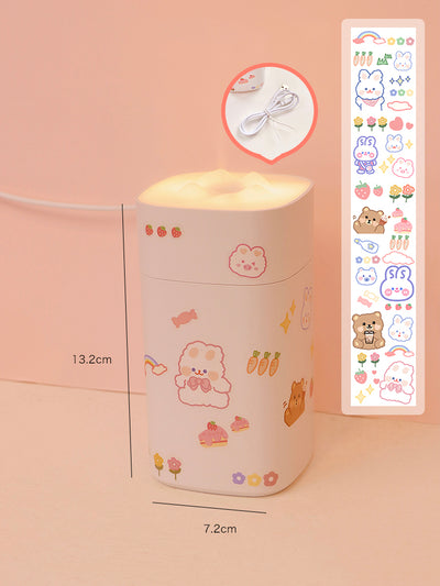 White desktop humidifier with a soft glow, decorated with cute cartoon animal and fruit stickers, shown with a USB cable and a sheet of additional stickers. - Image 4