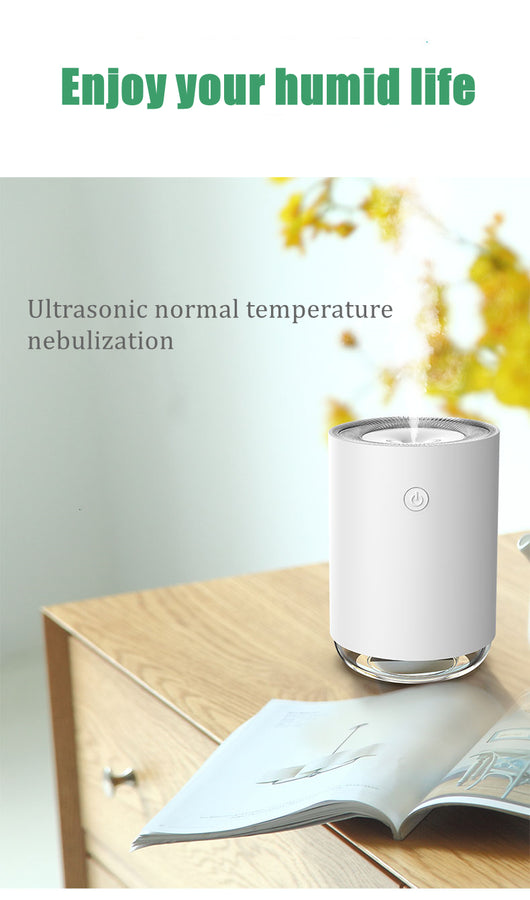 White cylindrical USB humidifier with a power button and a clear base, suitable for car or desktop use. - Image 15