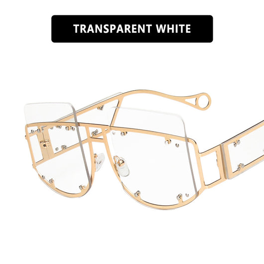 Red oversized rimless sunglasses with a unique geometric design and gold-tone metal temples. - Image 3