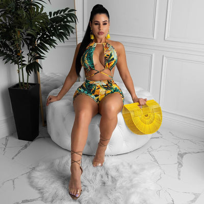 Two-piece bikini with green tropical leaf print, halter top, and high-waisted boxer shorts on a white background. - Image 17