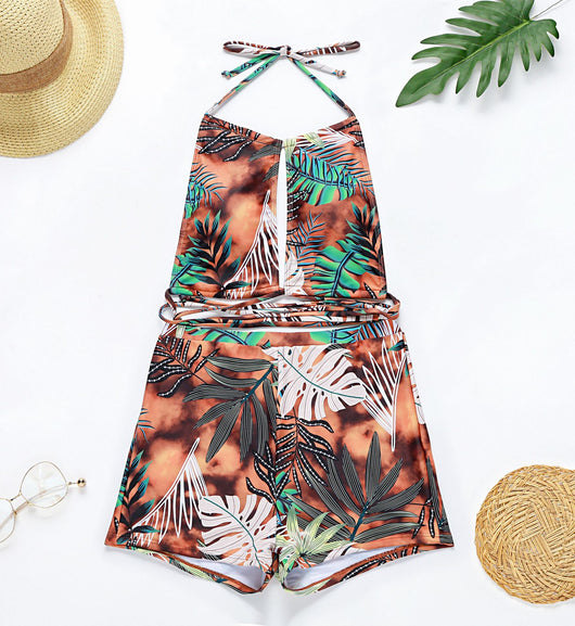Two-piece bikini with green tropical leaf print, halter top, and high-waisted boxer shorts on a white background. - Image 25