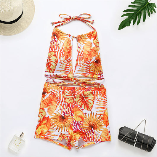 Two-piece bikini with green tropical leaf print, halter top, and high-waisted boxer shorts on a white background. - Image 21