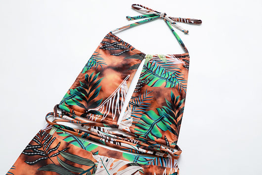 Two-piece bikini with green tropical leaf print, halter top, and high-waisted boxer shorts on a white background. - Image 28