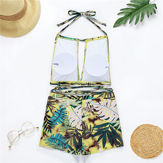 Two-piece bikini with green tropical leaf print, halter top, and high-waisted boxer shorts on a white background. - Image 13