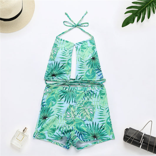 Two-piece bikini with green tropical leaf print, halter top, and high-waisted boxer shorts on a white background. - Image 8