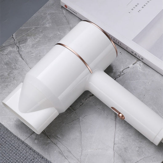 Mini negative ion hair dryer with a pink to purple gradient finish and silver accents, featuring a compact T-shape. - Image 6