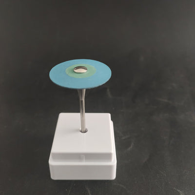 Zirconia diamond grinding head with a red and green abrasive disc on a metal shank, displayed in a white holder. - Image 7