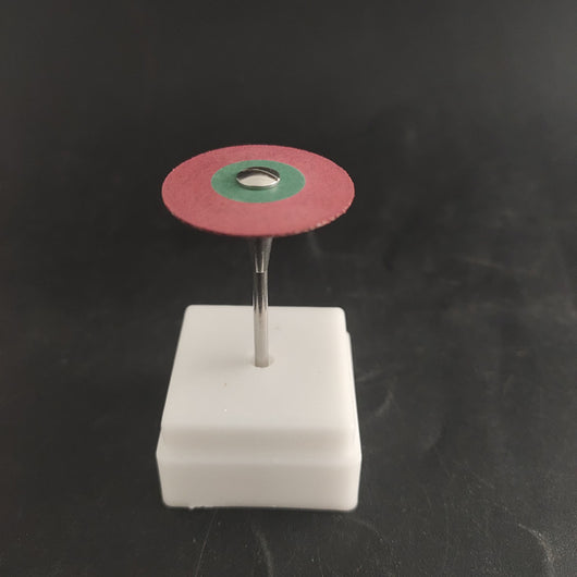 Zirconia diamond grinding head with a red and green abrasive disc on a metal shank, displayed in a white holder. - Image 4