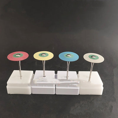 Zirconia diamond grinding head with a red and green abrasive disc on a metal shank, displayed in a white holder. - Image 5