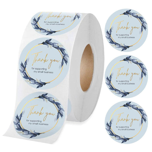 Roll of round 'Thank You for supporting my small business' stickers with a blue floral wreath design.