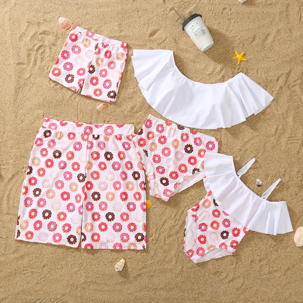 Family matching donut print swimsuits including men's shorts, boy's trunks, women's off-shoulder bikini, and girl's one-piece.