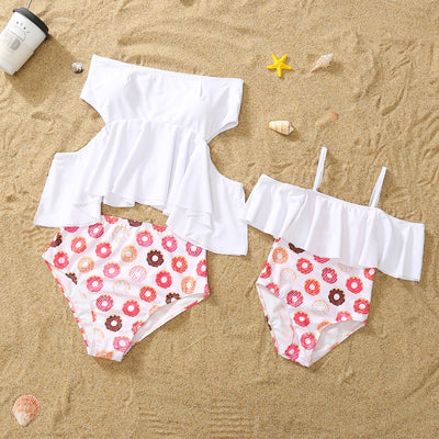 Family matching donut print swimsuits including men's shorts, boy's trunks, women's off-shoulder bikini, and girl's one-piece. - Image 5
