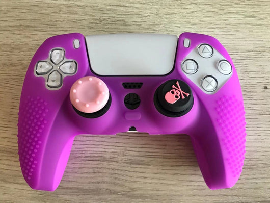 Pink silicone protective cover for PS5 gamepad with textured grips and skull and crossbones thumbstick cap. - Image 13