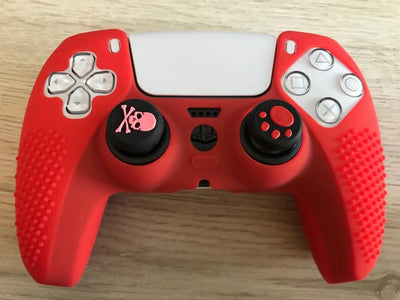 Pink silicone protective cover for PS5 gamepad with textured grips and skull and crossbones thumbstick cap. - Image 9