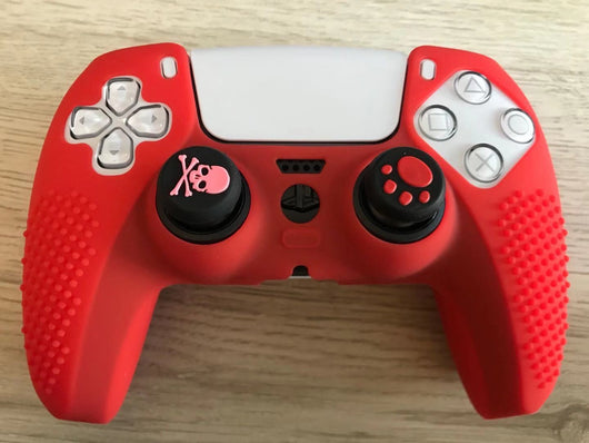 Pink silicone protective cover for PS5 gamepad with textured grips and skull and crossbones thumbstick cap. - Image 9