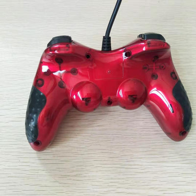 Red translucent USB wired gamepad with black buttons, D-pad, dual analog sticks, and a black cable. - Image 10
