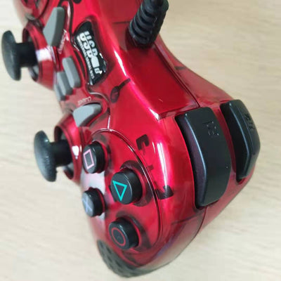 Red translucent USB wired gamepad with black buttons, D-pad, dual analog sticks, and a black cable. - Image 5