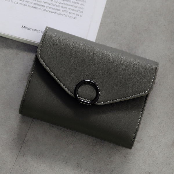 Billetera Compacta de Tres Pliegues con Cierre Simple y Diseño Minimalista