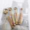 Set de 4 Cucharas Medidoras de Acero Inoxidable con Mango de Madera y Acabado Cobre