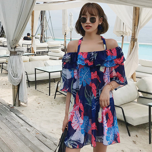 Women's three-piece swimsuit set with a navy blue tropical leaf print bikini and matching off-the-shoulder cover-up. - Image 9