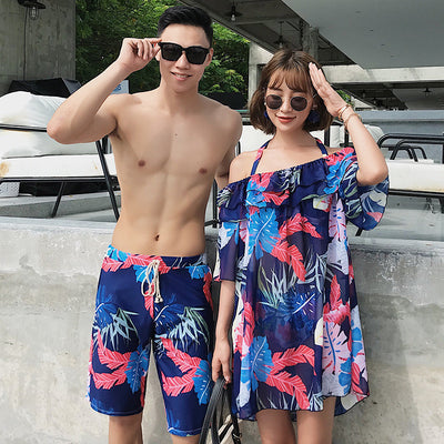 Women's three-piece swimsuit set with a navy blue tropical leaf print bikini and matching off-the-shoulder cover-up. - Image 5