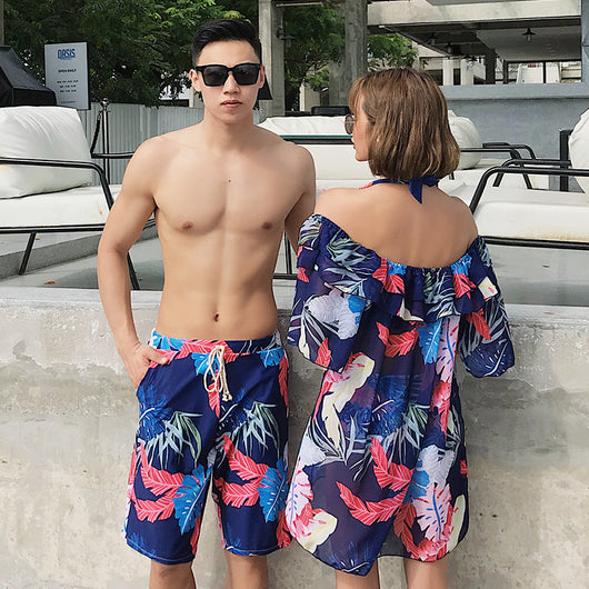 Women's three-piece swimsuit set with a navy blue tropical leaf print bikini and matching off-the-shoulder cover-up. - Image 3