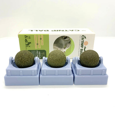 Assortment of rotating catnip balls in pink, green, gray, blue, and purple, each in a clear plastic case. - Image 4
