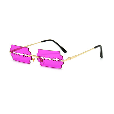 Orange razor blade shaped rimless sunglasses with gold metal frames and black ear tips on a white background. - Image 5