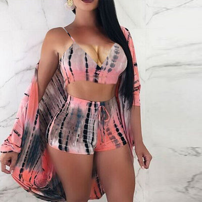 Woman wearing a black, green, and yellow tie-dye 3-piece swimsuit set with bralette, biker shorts, and cardigan. - Image 7