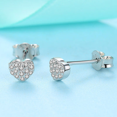 Sterling silver heart-shaped stud earrings with pavé clear zircons, featuring butterfly backings. - Image 5