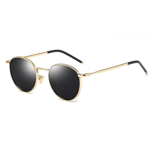 Women's retro round frame polarized sunglasses with gold metal frames, brown lenses, and orange temple tips.