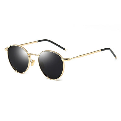 Women's retro round frame polarized sunglasses with gold metal frames, brown lenses, and orange temple tips.