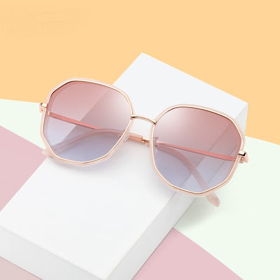 Ladies' rose gold-toned octagonal polarized sunglasses with gradient gray lenses on a white background. - Image 7