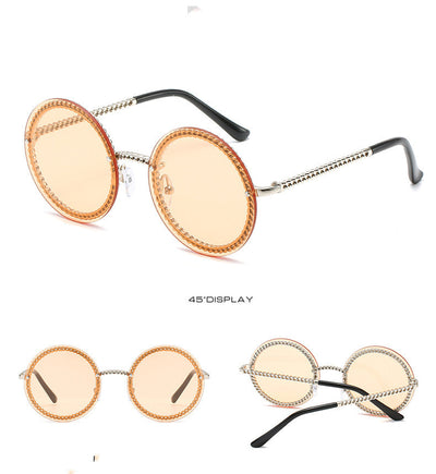 Frameless round sunglasses with pink gradient lenses and gold-tone chain detail on temples and lens edges. - Image 7