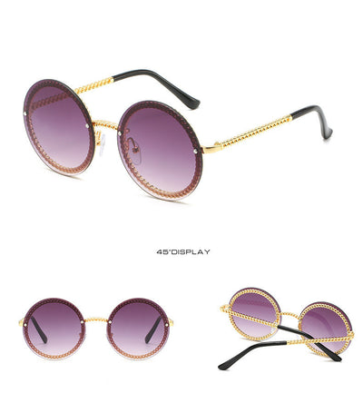 Frameless round sunglasses with pink gradient lenses and gold-tone chain detail on temples and lens edges. - Image 12
