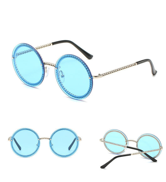 Frameless round sunglasses with pink gradient lenses and gold-tone chain detail on temples and lens edges. - Image 11