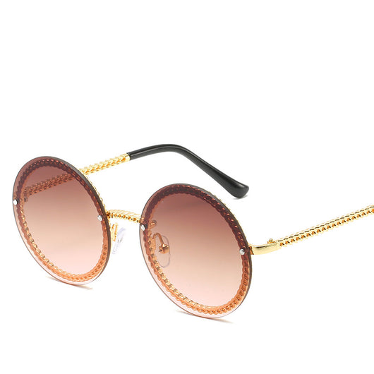 Frameless round sunglasses with pink gradient lenses and gold-tone chain detail on temples and lens edges. - Image 2