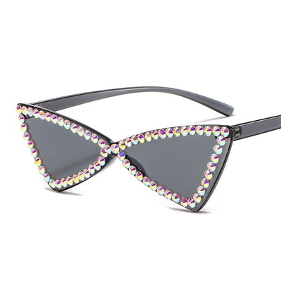Pink retro triangle rimless sunglasses with iridescent rhinestone embellishments and a cat-eye shape. - Image 4