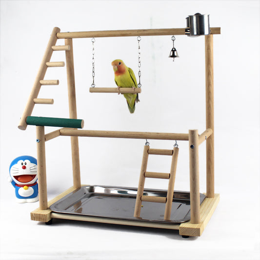 Wooden bird stand with perches, ladders, a swing, bell, and feeding cup, featuring a green lovebird.